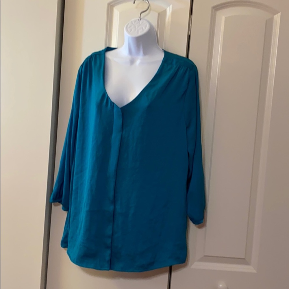 blouse turquoise color.